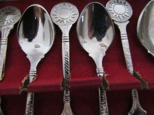 6 SILVERPLATED SPOONS WITH SUN IMAGE  STILL IN BOX.