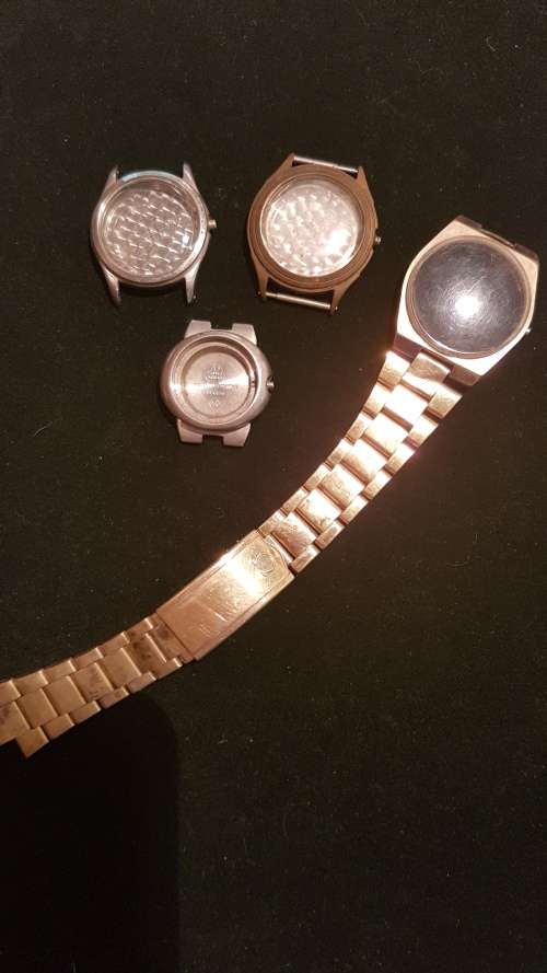 4 Vintage Omega watch housings and 1x strap