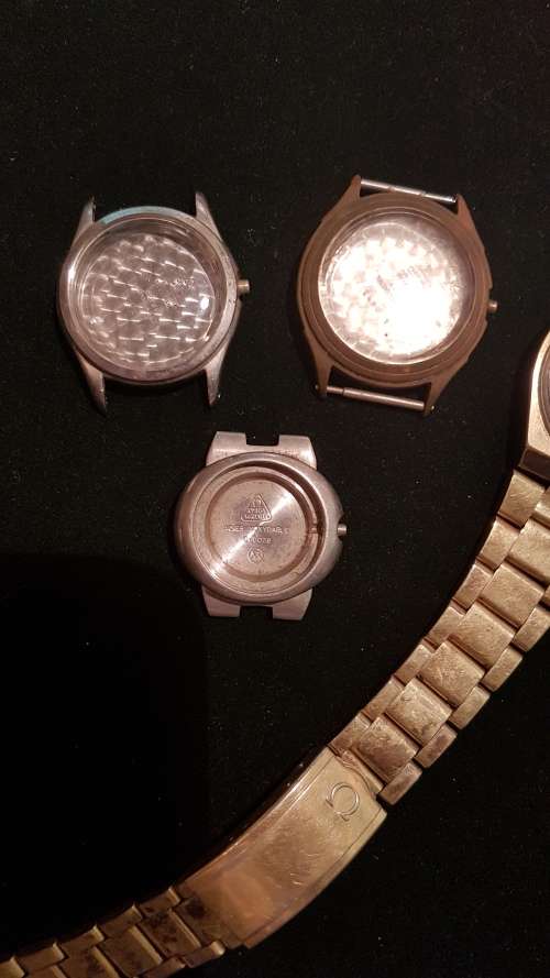 4 Vintage Omega watch housings and 1x strap