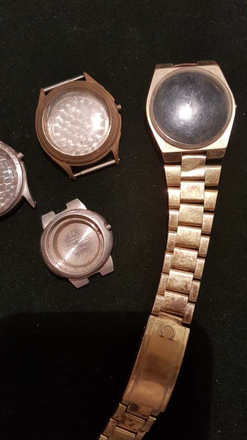 4 Vintage Omega watch housings and 1x strap