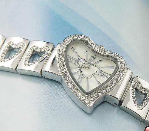 VERY CUTE HEART SHAPED  WATCH WITH DIOMANTE EDGING AND MOTHER OF PEARL FACE