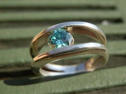 Sterling silver 0.65 ct fancy green moissanite diamond ring - thirty (30) days to pay.  Value R3,925