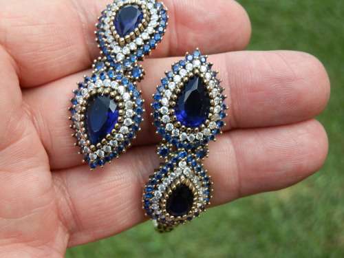 Heavy (24.5g) sterling silver bracelet set with sapphire blue and clear gems