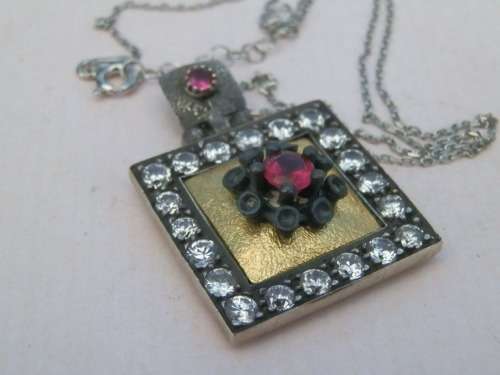 Sterling silver ruby pendant and chain, 11.2 g.