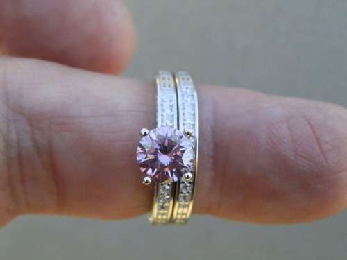 Sterling silver 0.95 ct fancy pink diamond two-ring set.