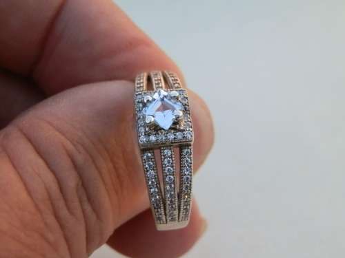 Elegant SOLID sterling silver moissanite diamond ring - weight 4.2 g.  Thirty (30) days to pay.