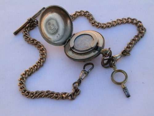 Antique sovereign holder with a Kruger 1896 sixpence inside, on fob chain, circa 1900