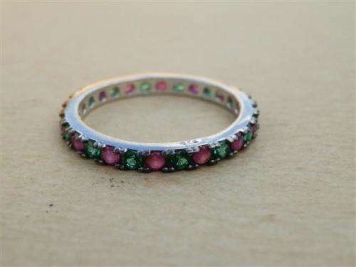 Charming solid sterling silver ruby and emerald ring - weight 1.95 g.