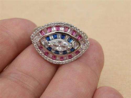 Sparkling solid sterling silver ruby and blue sapphire ring - weight 6.13 g.
