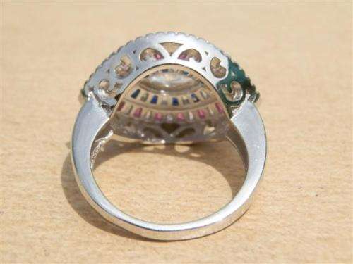 Sparkling solid sterling silver ruby and blue sapphire ring - weight 6.13 g.