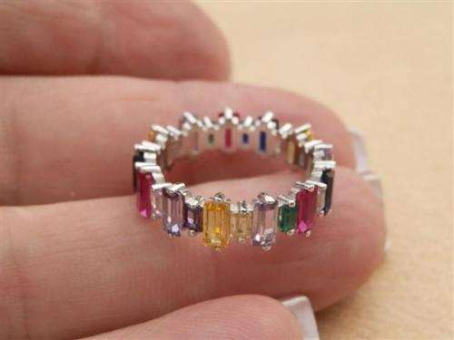 Alluring solid sterling silver ruby, blue sapphire and topaz ring - weight 3.15 g.