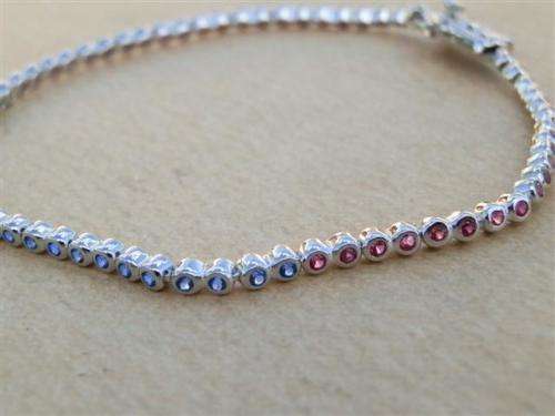 Charming solid sterling silver ruby and blue sapphire bracelet - weight 5.45 g.