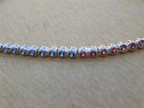 Charming solid sterling silver ruby and blue sapphire bracelet - weight 5.45 g.