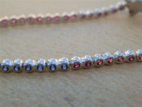 Charming solid sterling silver ruby and blue sapphire bracelet - weight 5.45 g.