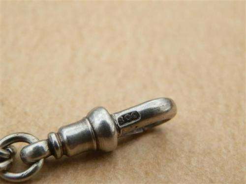 Antique lady's Albert fob chain with pocket watch and fob seal.