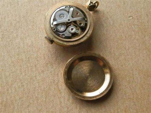 Antique lady's Albert fob chain with pocket watch and fob seal.