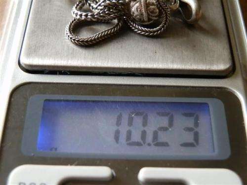 Antique lady's Albert fob chain with pocket watch and fob seal.