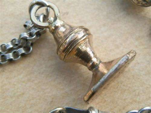 Antique lady's Albert fob chain with pocket watch and fob seal.