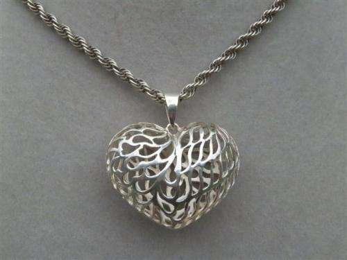 Awesome heavy solid sterling silver rope chain and a large filigree heart pendant - weight 21.94 g.