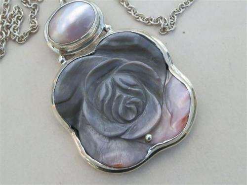 Smashing solid sterling silver mother of pearl pendant and chain - weight 48.7 g.