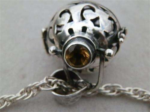 Exquisite solid sterling silver citrine ball pendant on a rope chain - weight 22.9 g.