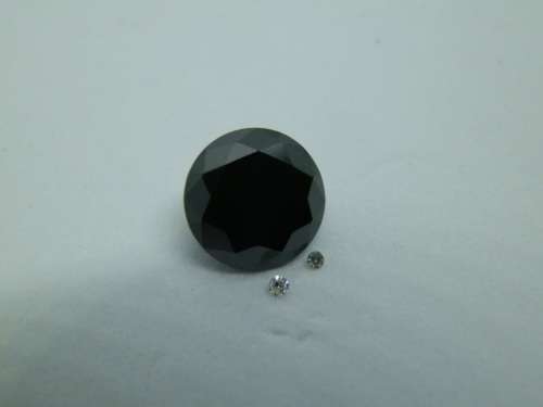 Awesome 1.65 ct black diamond and two small white diamonds