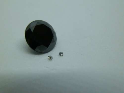 Awesome 1.65 ct black diamond and two small white diamonds