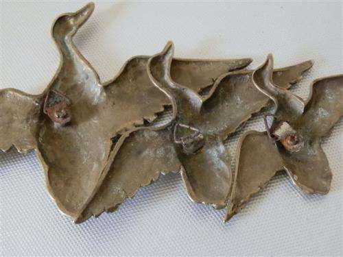 Vintage brass flying ducks