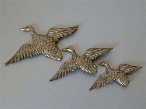 Vintage brass flying ducks