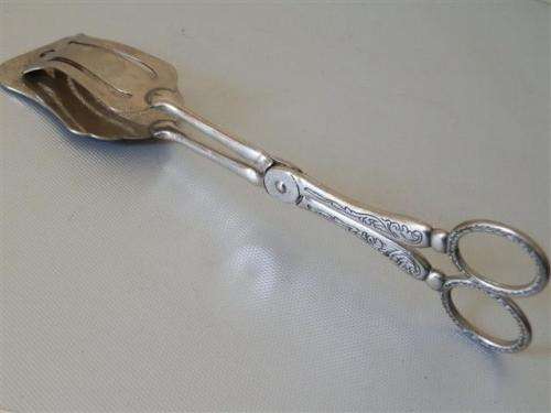 Vintage silver engraved tongs