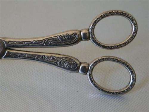 Vintage silver engraved tongs