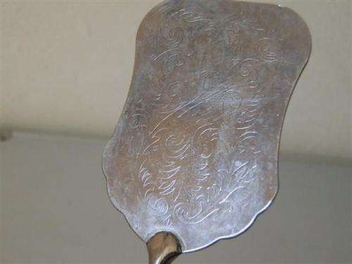 Vintage silver engraved tongs