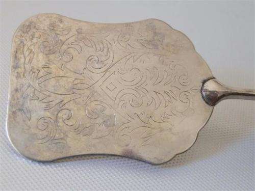 Vintage silver engraved tongs