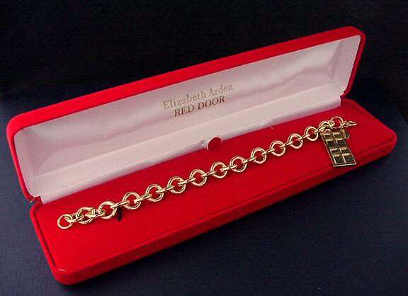 14KT GOLD HGE RED DOOR BRACELET BY ELIZABETH ARDEN