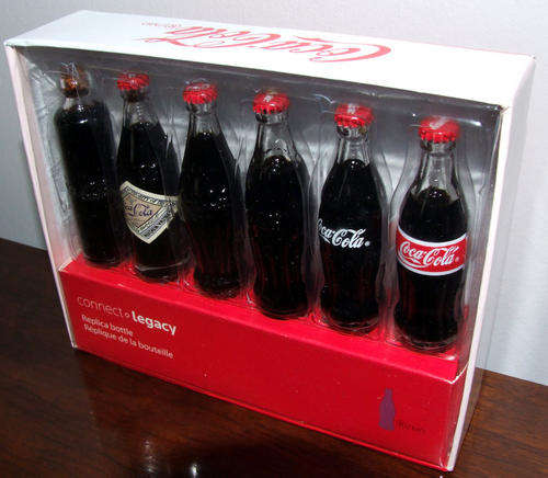 EVOLUTION OF THE COCA COLA BOTTLE - 6 MINIATURE COKE BOTTLES