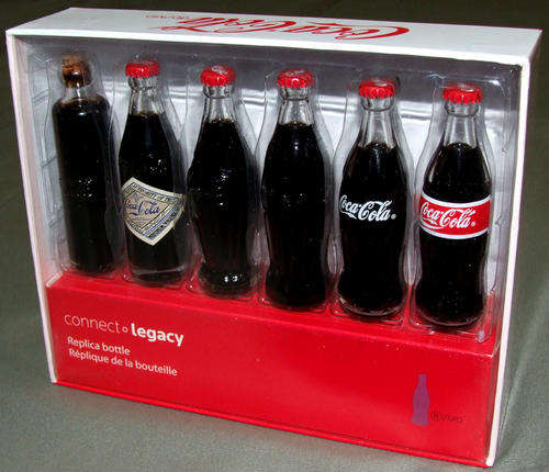 EVOLUTION OF THE COCA COLA BOTTLE - 6 MINIATURE COKE BOTTLES