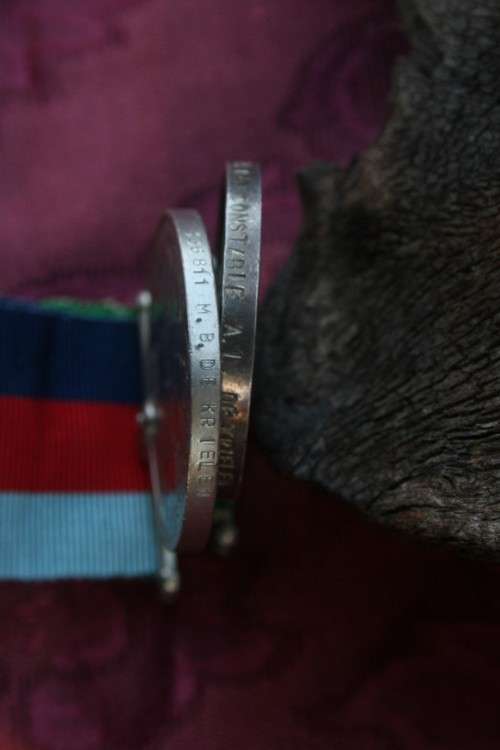 Medals issued to father and daughter.