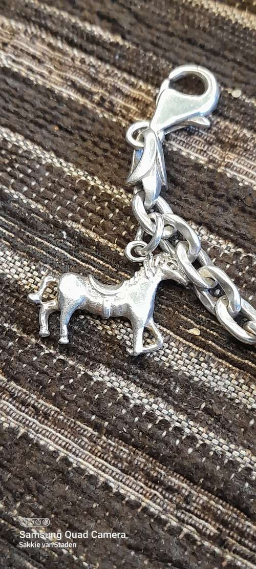 Heavy sterling silver bracelet with solid sterling silver charms 20.9cm