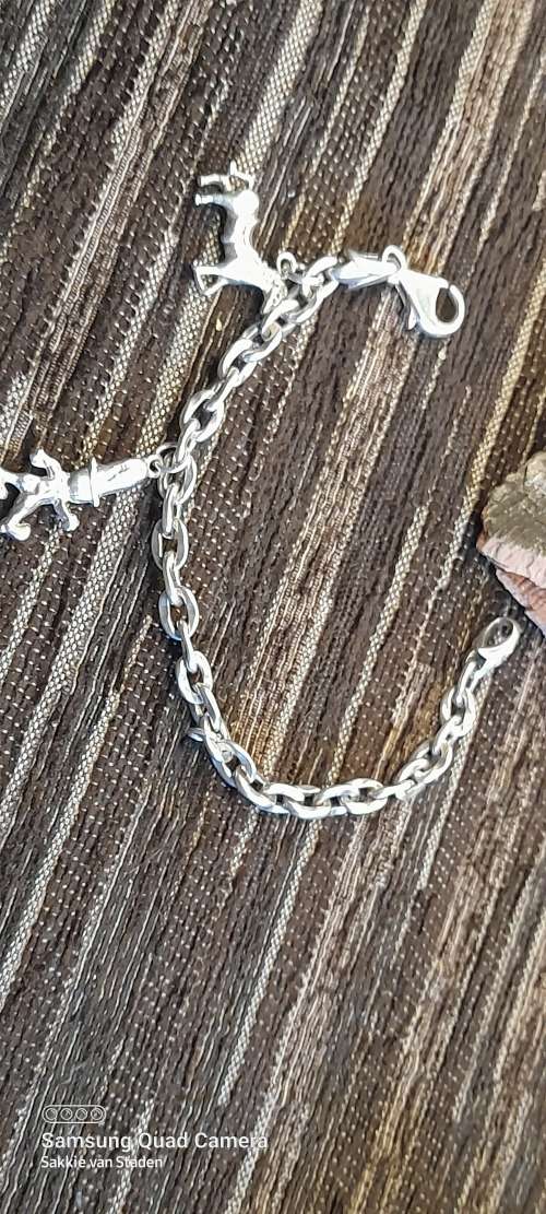 Heavy sterling silver bracelet with solid sterling silver charms 20.9cm