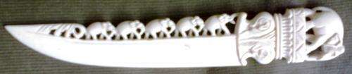 Ivory letter opener with delicate, detailed carvings of elephants