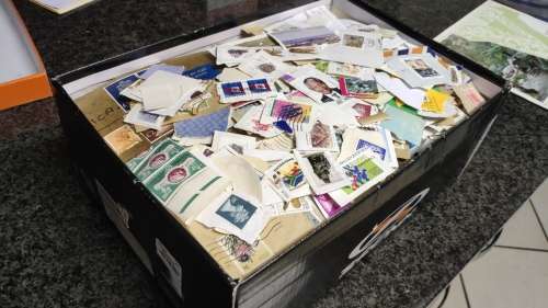 Shoe box full of stamps from all over the world but mostly South African
