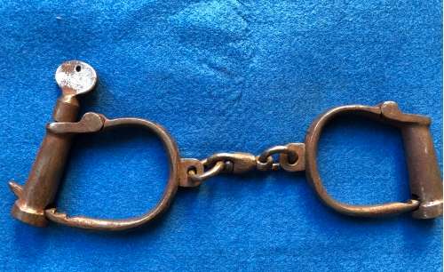 Very old handcuffs with key