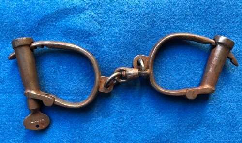 Very old handcuffs with key