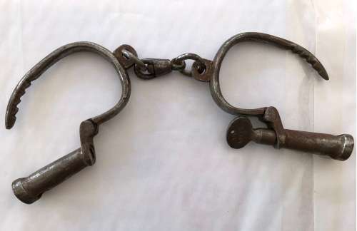 Very old handcuffs with key
