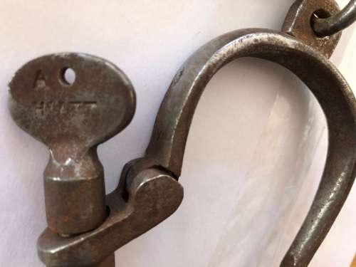 Very old handcuffs with key