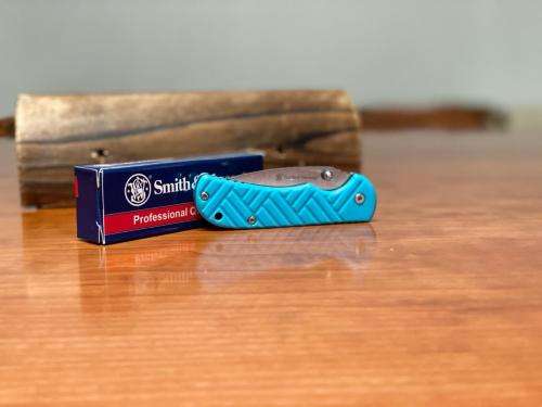 SMITH AND WESSON Stainless Steel Folding Knife with Clip Point Blade and Nylon Handle