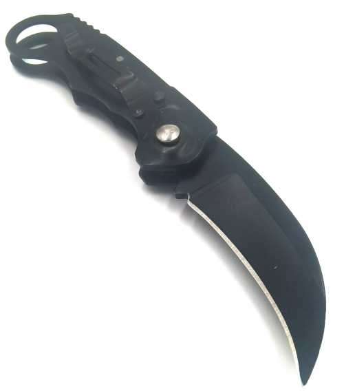`Shadow Strike: The Deadly Precision of the Black Push Button Karambit`