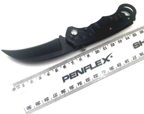 `Shadow Strike: The Deadly Precision of the Black Push Button Karambit`