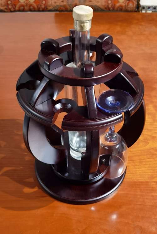 Antique wine bottle and glass stand