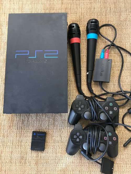 SONY PLAYSTATION 2 CONSOLE WITH 7 GAMES, 2 SINGSTAR MICROPHONES, 2 WIRED CONTROLS!!!!